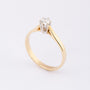 Gold solitaire ring with a brilliant