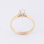 Gold solitaire ring with a brilliant