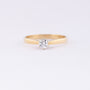 Gold solitaire ring with a brilliant