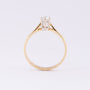 Gold solitaire ring with a brilliant