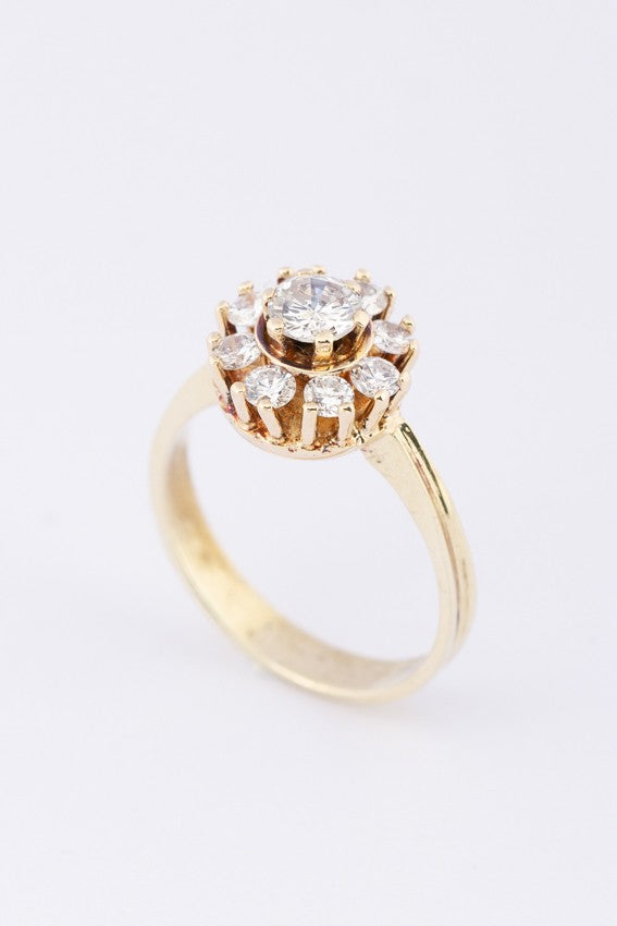 Gold entourage ring with diamonds
