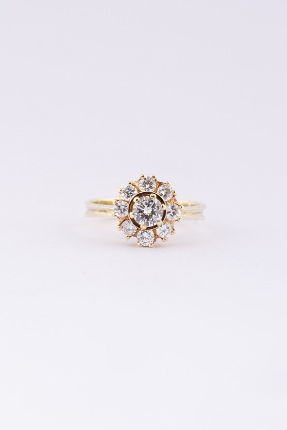 Gold entourage ring with diamonds