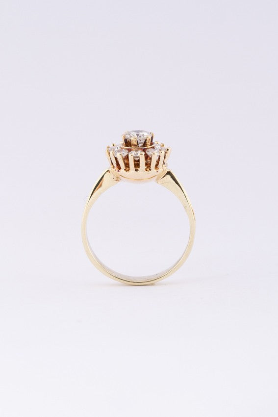 Gold entourage ring with diamonds