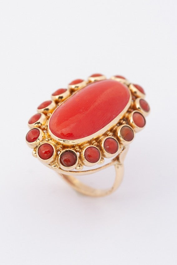Gold entourage ring with blood corals