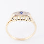 Gouden rij ring met een saffier en diamanten
