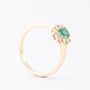 Gouden entourage ring met smaragd en briljanten