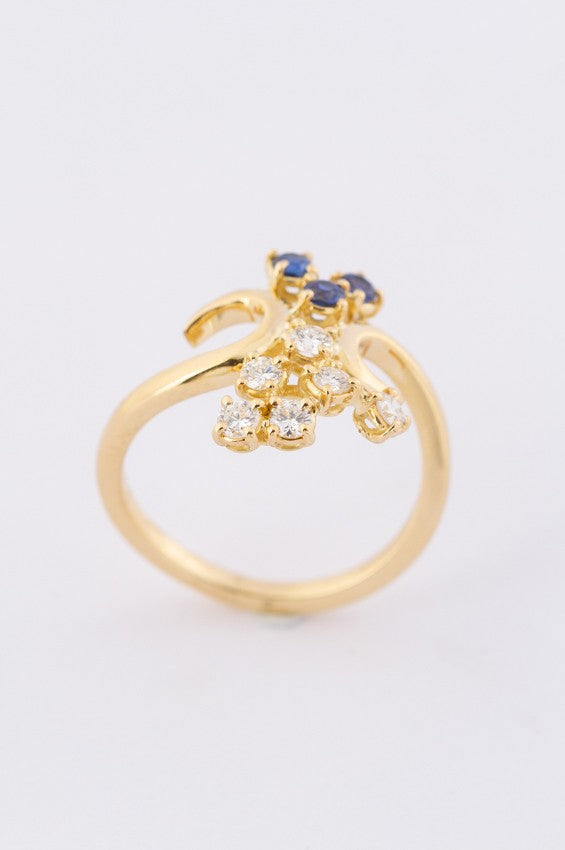 Gold ring with diamonds and sapphires
