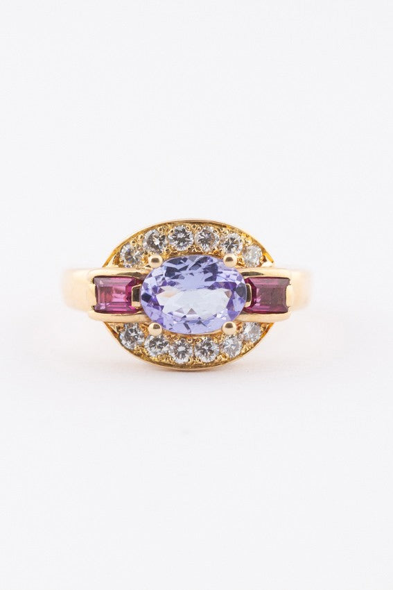 Gouden entourage ring met een tanzaniet, robijnen en briljanten