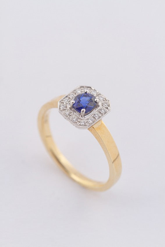Gold ring with sapphire and diamonds