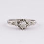 Platinum solitaire ring with a brilliant and diamonds