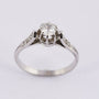 Platinum solitaire ring with a brilliant and diamonds