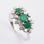 White gold ring with emerald and brilliant