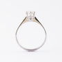 White gold solitaire ring with 0.60 ct brilliant cut diamond.