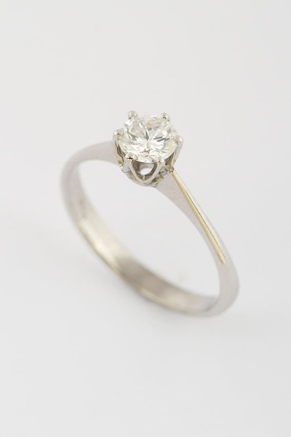 White gold solitaire ring with 0.60 ct brilliant cut diamond.