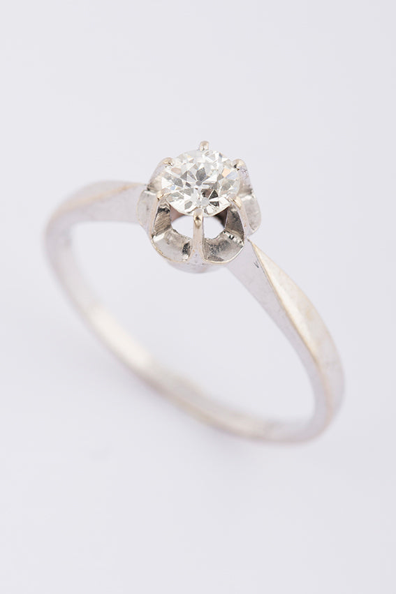 White gold solitaire ring with an old-cut brilliant