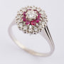 White gold entourage ring with brilliant and ruby