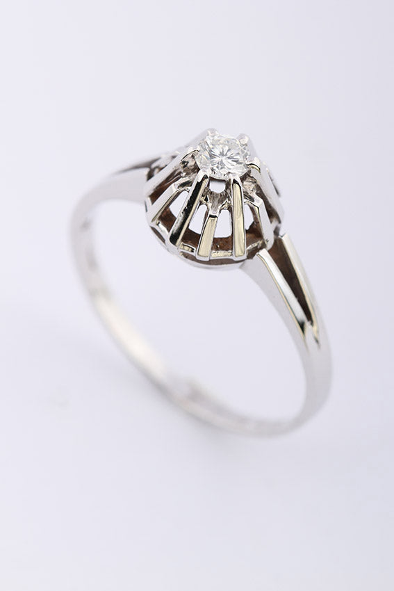 White gold solitaire ring with 0.18 ct brilliant cut diamond.