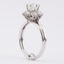 Wit gouden entourage ring met 7 briljanten