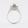 White gold entourage ring with brilliant and diamond