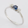 White gold row ring with sapphire and brilliant
