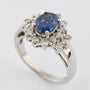 White gold entourage ring with sapphire and brilliant