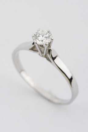 White gold solitaire ring with 0.63 ct brilliant cut diamond.
