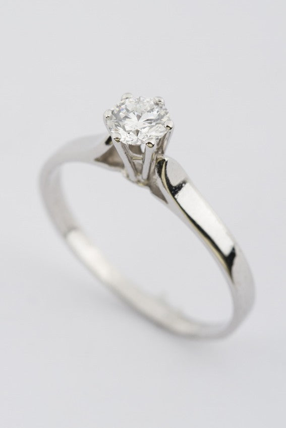 White gold solitaire ring with 0.63 ct brilliant cut diamond.