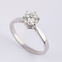 White gold solitaire ring with a 1.0 ct brilliant cut diamond.