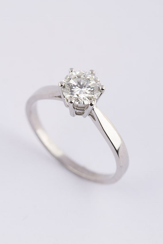 White gold solitaire ring with a 1.0 ct brilliant cut diamond.