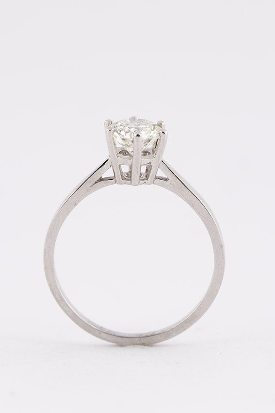 White gold solitaire ring with a 1.0 ct brilliant cut diamond.