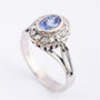 White gold entourage ring with sapphire and diamonds