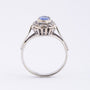White gold entourage ring with sapphire and diamonds