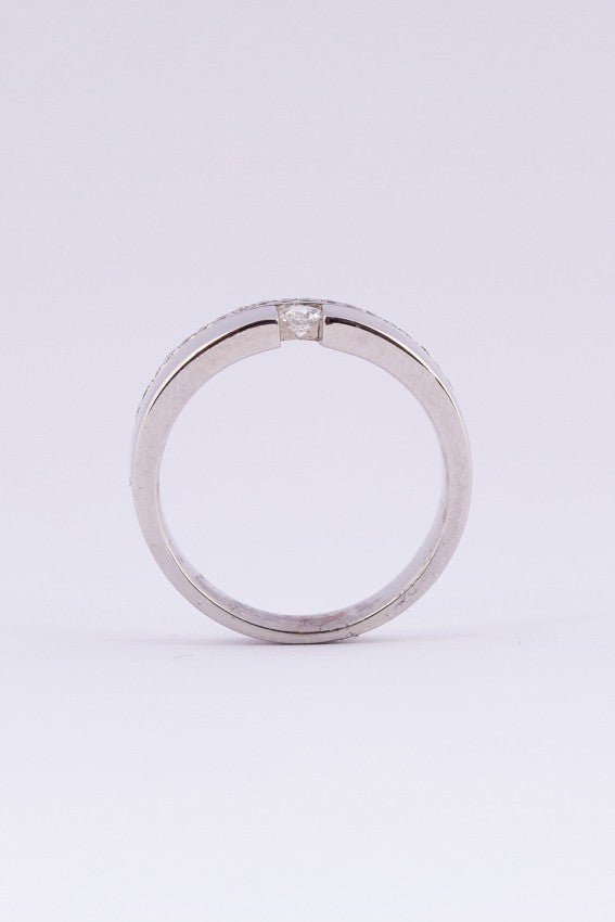 White gold solitaire ring with diamonds