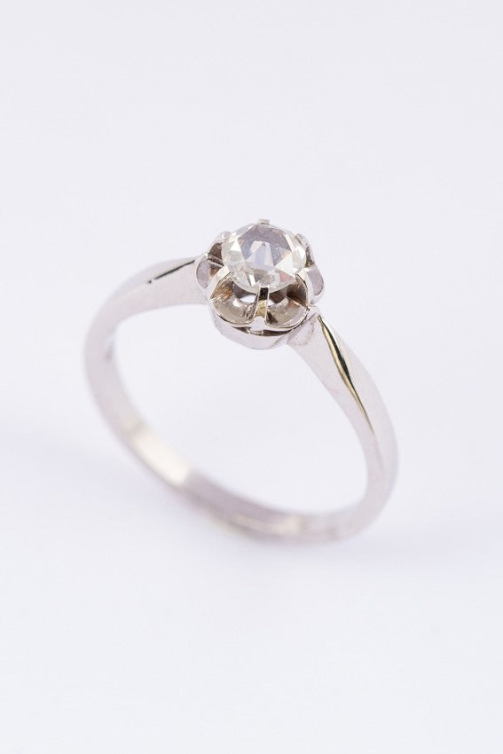 white gold solitaire ring with a rose-cut diamond