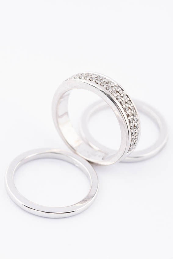White gold band ring with diamonds together with sliding rings