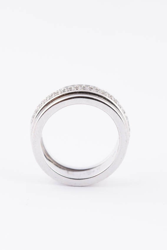 White gold band ring with diamonds together with sliding rings