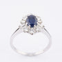 White gold entourage ring with sapphire, brilliants and diamonds