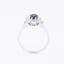 White gold entourage ring with sapphire, brilliants and diamonds