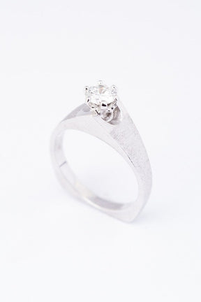White gold solitaire ring with a 0.43 ct brilliant cut diamond.