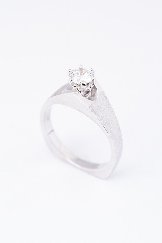 White gold solitaire ring with a 0.43 ct brilliant cut diamond.