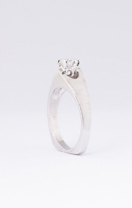 White gold solitaire ring with a 0.43 ct brilliant cut diamond.