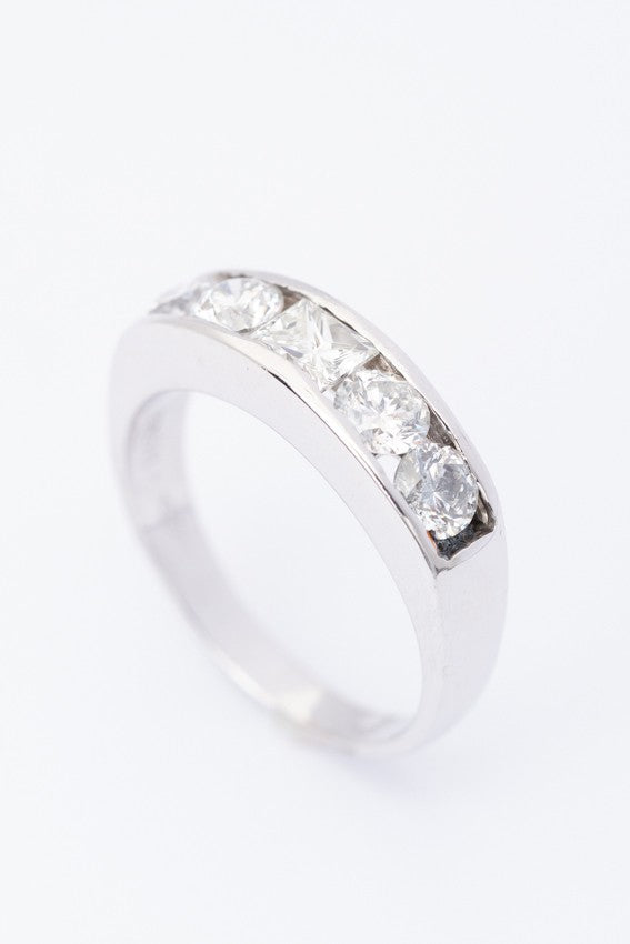 White gold row ring with a princess and round cut diamonds