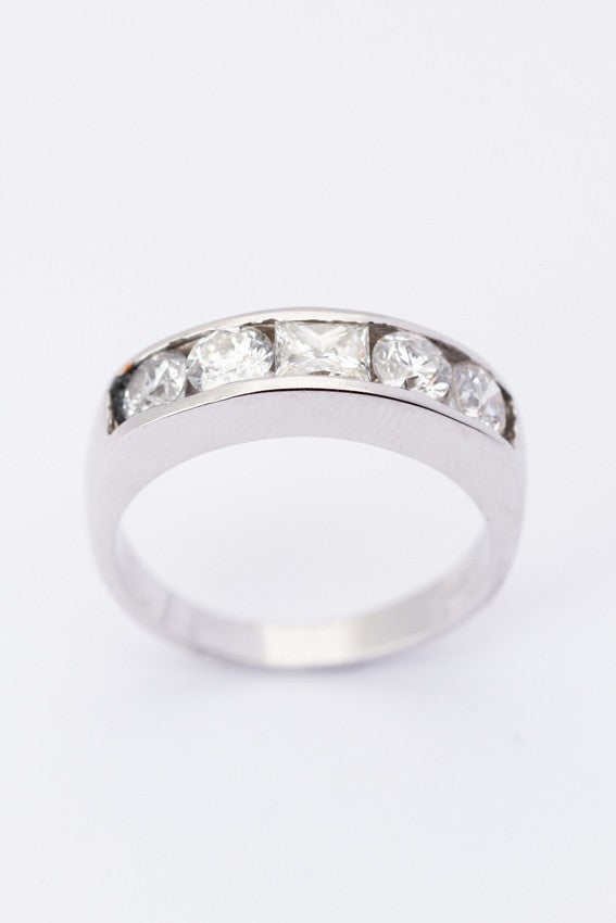 White gold row ring with a princess and round cut diamonds