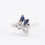White gold fantasy ring with 2 marquise-cut sapphires and brilliant-cut diamonds