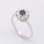 White gold entourage ring with sapphire and diamonds