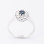 White gold entourage ring with sapphire and diamonds