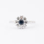 White gold entourage ring with sapphire and diamonds
