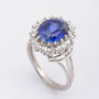 White gold entourage ring with sapphire and diamonds