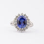 White gold entourage ring with sapphire and diamonds