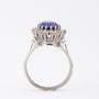 White gold entourage ring with sapphire and diamonds